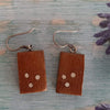 Small reclaimed wood earrings inlaid with silver